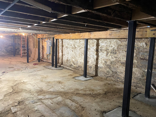 Exposed wood framing during a structural repair project